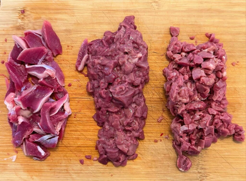 Overhead photo of chopped chicken gizzard, liver and heart for this authentic Thai Chicken Larb with Giblets recipe
