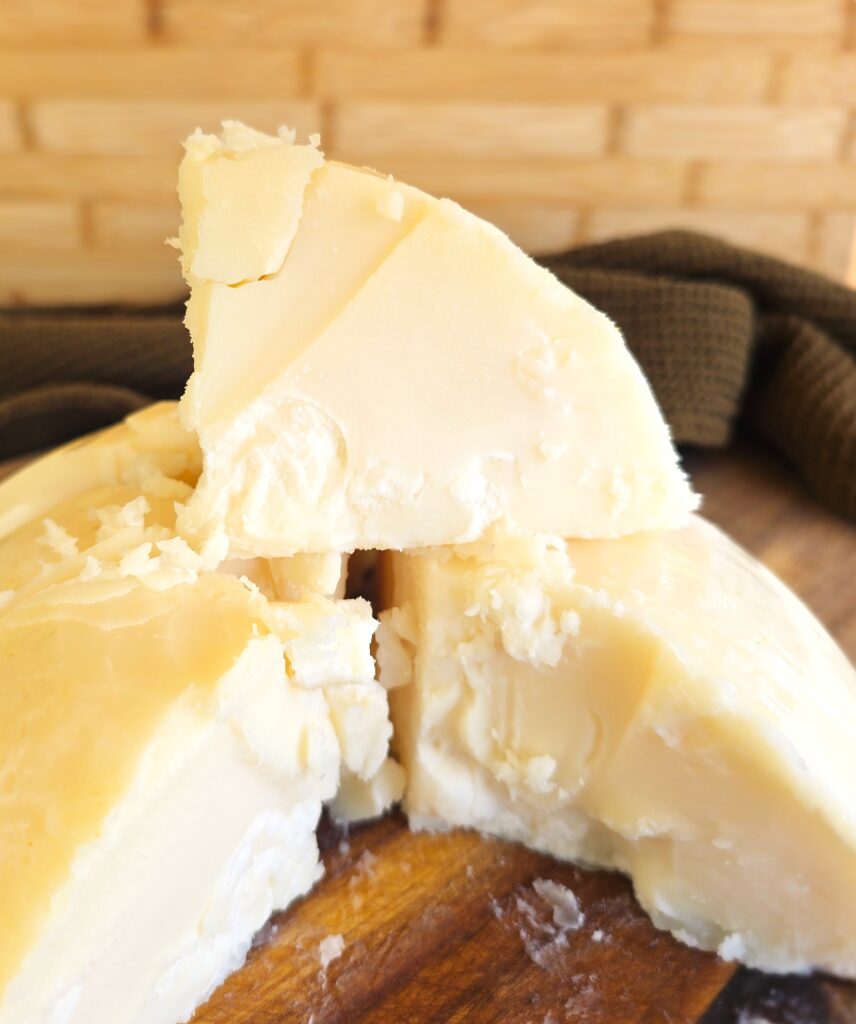 Pure, white chunks of beef tallow from a solid tallow cake, showing the white interior after rendering, clarifying and purifying beef fat